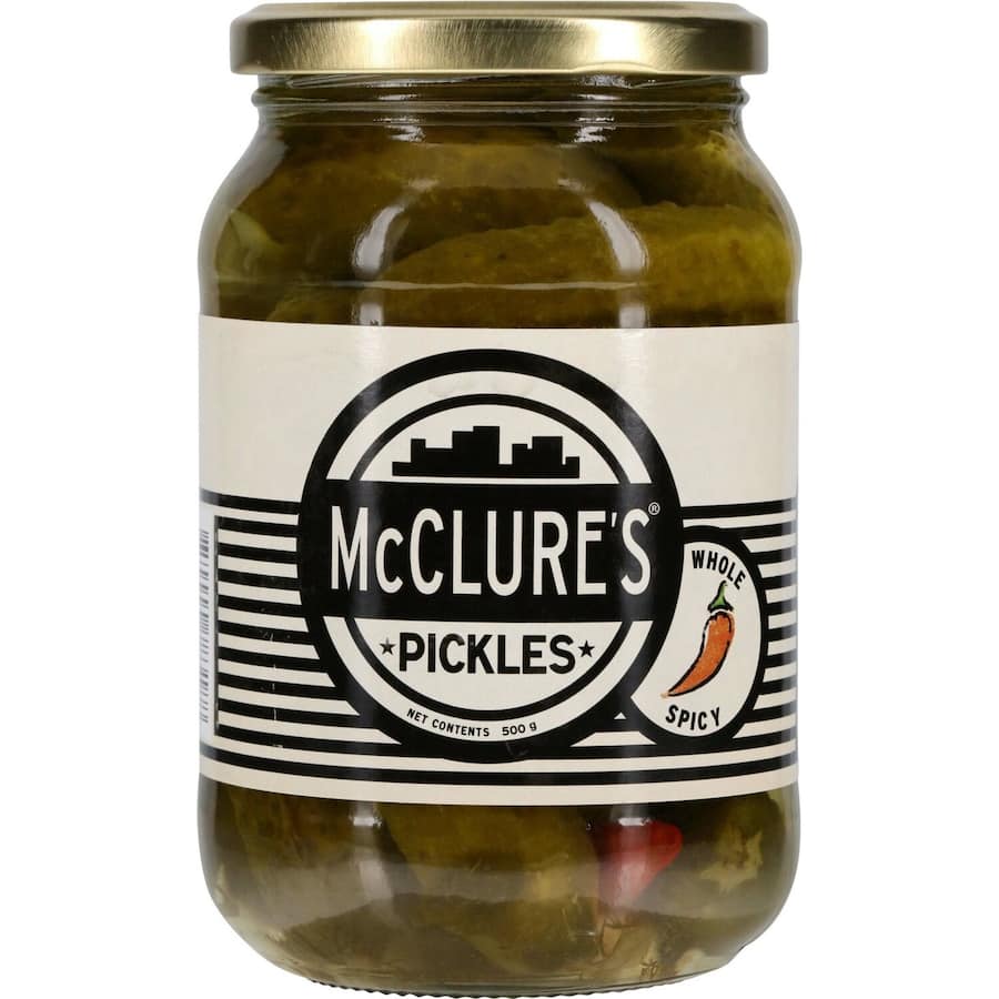 Crunchy McClures Gherkins Spicy Pickles, bursting with heat and flavor, perfect for snacking or enhancing meals.