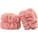 Soft headband with wired bow and plush wristbands for mess-free skincare and makeup application. Perfect self-care accessory.