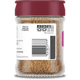 Cajun seasoning blend in a glass shaker, featuring paprika, basil, chili, and fennel for bold Louisiana flavor.