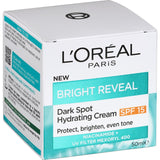 L'Oréal Bright Reveal Cream SPF 15 targets dark spots, hydrates, and provides UV protection for a radiant complexion.