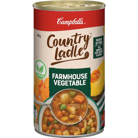 A can of Campbell's Country Ladle Farmhouse Vegetable Soup, filled with fresh vegetables and grains, 99% fat-free.