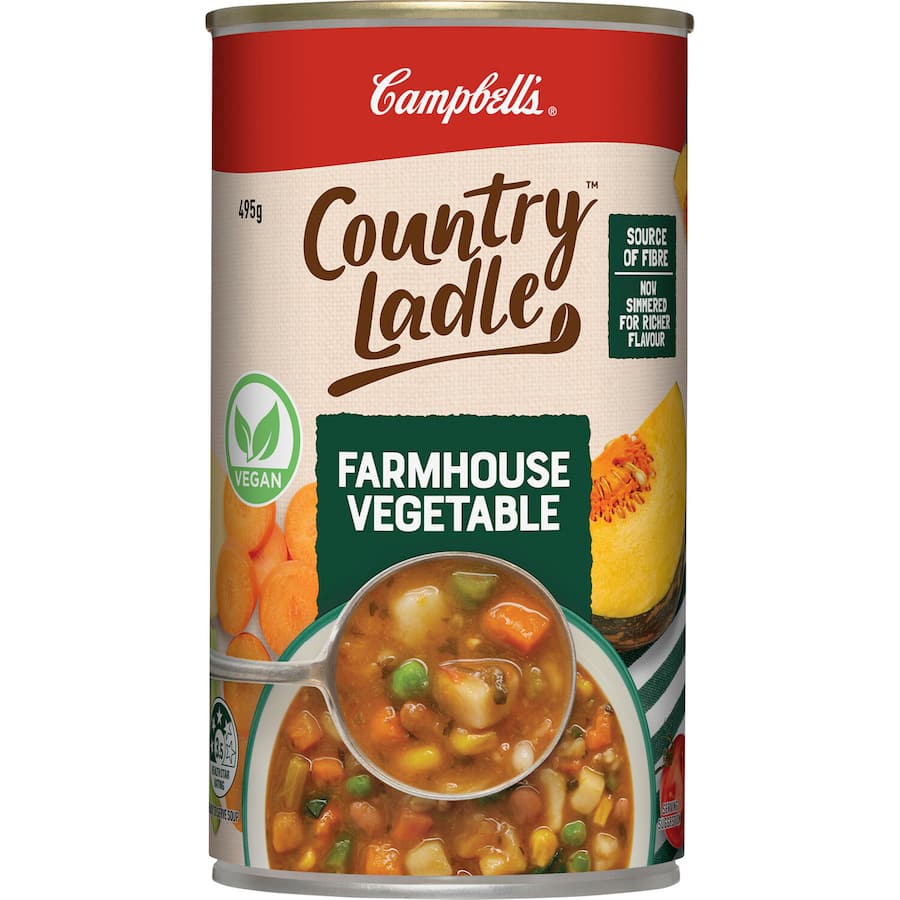 A can of Campbell's Country Ladle Farmhouse Vegetable Soup, featuring fresh vegetables and grains, 99% fat-free and nostalgic.