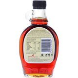 Ceres Organics Maple Syrup in a bottle, showcasing its rich, dark color and perfect for enhancing sweet dishes.