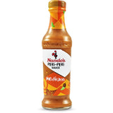 Nando's Peri Peri Sauce Medium: a flavorful blend of spices and tang, ideal for marinating, dipping, and enhancing meals.