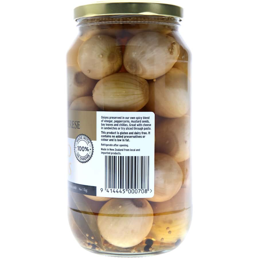 Maison Therese Pickled Onions in a jar, featuring New Zealand onions in a spicy vinegar blend, perfect for enhancing meals.