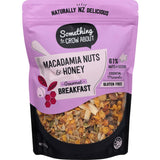 Handcrafted gluten-free muesli with macadamia nuts, honey, and seeds for a nutritious, energy-boosting breakfast.