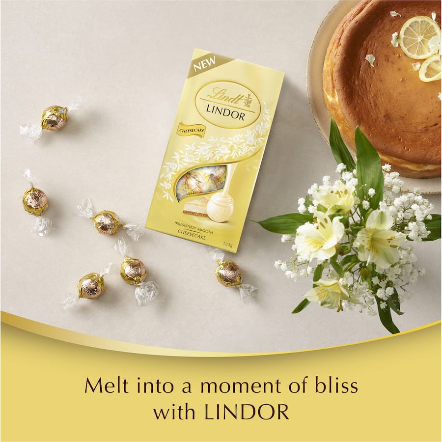 Lindt Lindor Cheesecake featuring a white chocolate shell filled with smooth cheesecake and a hint of lemon for a blissful indulgence.