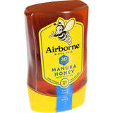 Airborne Honey Manuka Multifloral jar showcasing rich golden honey, packed with antioxidants for immunity and well-being.