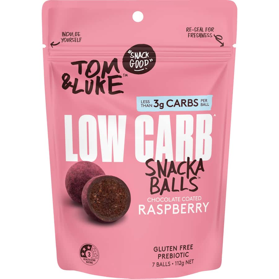 Low-carb raspberry snack balls coated in dark chocolate, featuring dates, cocoa, and coconut for a guilt-free treat.