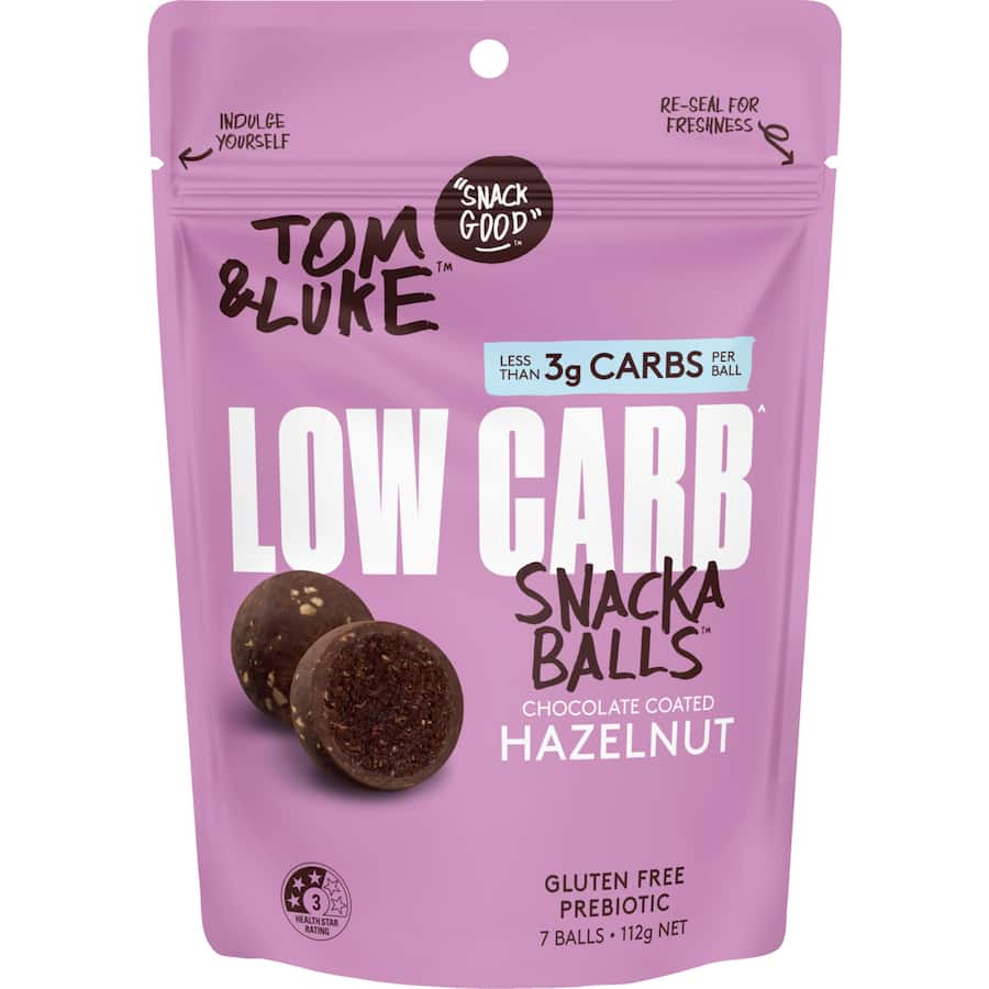 Tom & Luke Low Carb Hazelnut Snack Balls: gluten-free, chocolate-coated bites with raspberry dust, less than 2g of sugar.