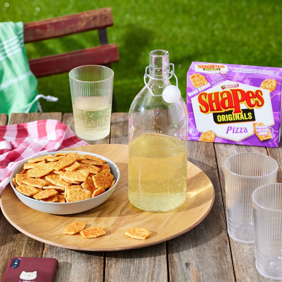 Crispy Arnotts Shapes Crackers Pizza Originals, delivering bold pizza flavor for perfect snacking at any occasion.