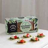 Crispy garlic and olive oil wafers, perfect for pairing with cheeses, dips, and spreads for a gourmet snack experience.