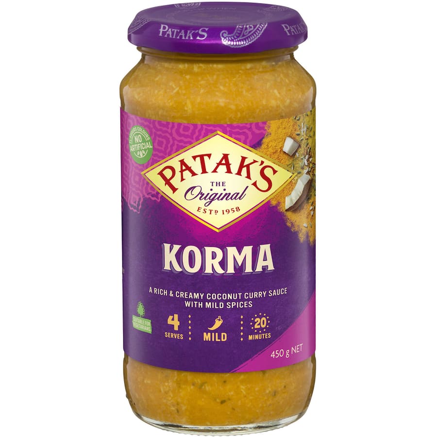 A jar of Patak's Korma Simmer Sauce, showcasing rich coconut and aromatic spices for a mild curry experience.