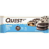 Quest Protein Bar in Cookies & Cream flavor, dipped in chocolate, offering 20g protein and 4g net carbs for guilt-free snacking.
