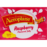 A bowl of Aeroplane Jelly Original Raspberry, showcasing its vibrant red color and smooth texture, perfect for desserts.