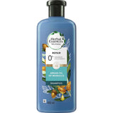 Herbal Essences Bio:renew Repairing Shampoo with Argan Oil, nurturing dry hair with hydration and a luxurious citrus aroma.