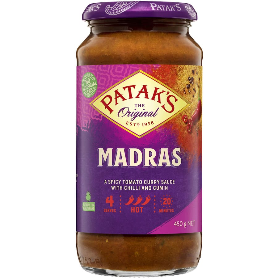 A jar of Patak's Madras Simmer Sauce, featuring a spicy tomato flavor for easy, authentic Indian curries in 20 minutes.