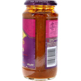 A jar of Patak's Madras Simmer Sauce, featuring a spicy tomato-based curry mix with aromatic spices for quick Indian meals.