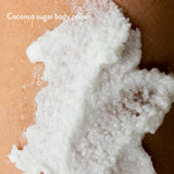 Exfoliating body scrub with Coconut and Shea Butter for smooth, hydrated skin, free from harmful chemicals.