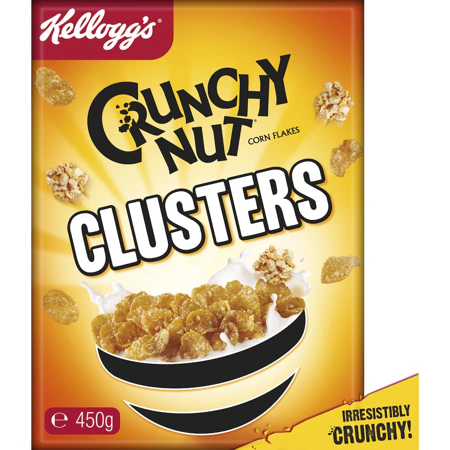 Golden corn flakes with peanut pieces and honey coating, perfect for a delicious breakfast or snack.