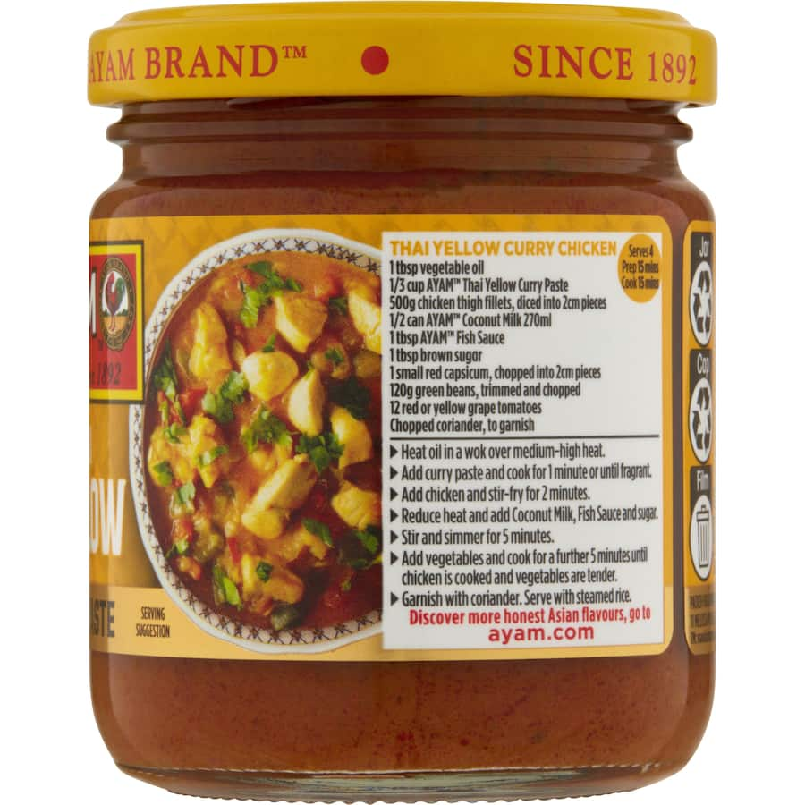 Ayam Thai Yellow Curry Paste in a jar, featuring aromatic spices for easy, authentic Thai cooking.