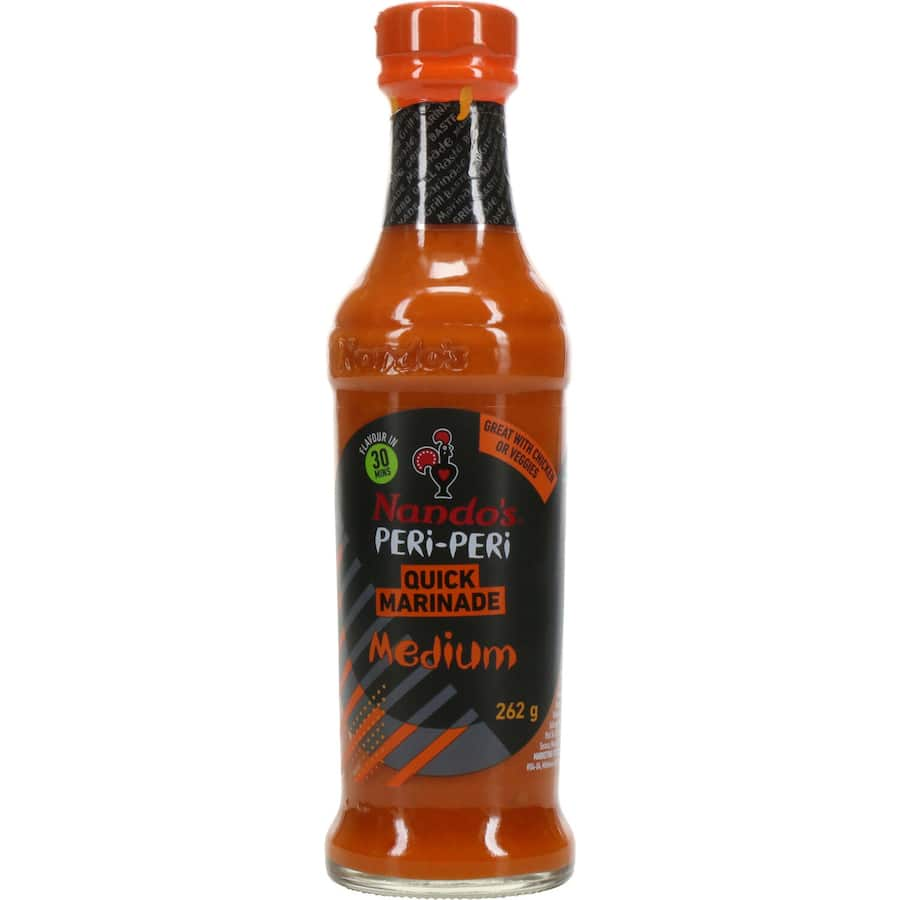 Nandos Peri Peri Marinade Medium bottle showcasing vibrant sauce, ideal for adding spicy flavor to meats and vegetables.