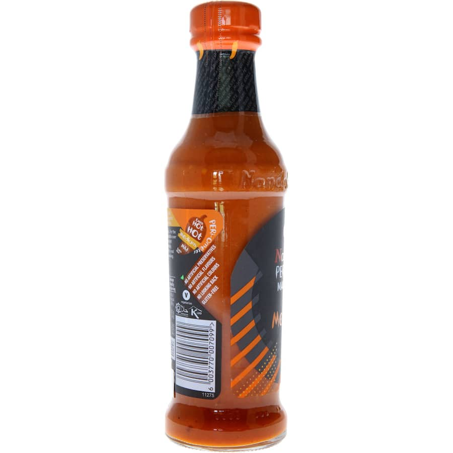 Nandos Peri Peri Marinade Medium bottle showcasing a spicy and zesty sauce for marinating meats and veggies.