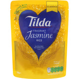 Aromatic Tilda Jasmine Rice, steamed for fluffy texture, perfect for Thai curry and Southeast Asian dishes.