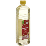 A 750ml bottle of Woolworths Peanut Oil, perfect for frying and enhancing Asian dishes with a mild nutty flavor.