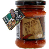 A jar of Exotic Food Asian Panang Curry Paste, featuring vibrant ingredients like shallots, lemongrass, and spices for authentic Thai cuisine.