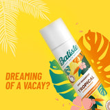 Batiste Dry Shampoo Tropical can with coconut and pineapple design, providing instant freshness and volume for hair.