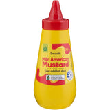 Woolworths Mustard Mild in a squeeze bottle, perfect for enhancing dishes like hotdogs and sandwiches with a tangy flavor.