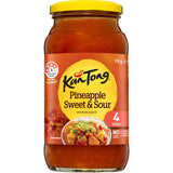 Kan Tong Pineapple Sweet & Sour sauce in a glass jar, perfect for quick, flavorful stir fry with fresh veggies and meat.