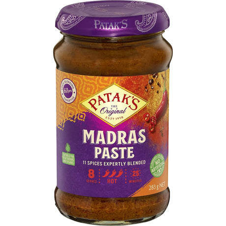 Pataks Madras Paste bottle showcasing a blend of spices for authentic Indian curry cooking.