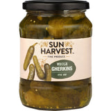 A jar of Sun Harvest Gherkins Whole showcasing crunchy pickles in a tangy vinegar solution, ideal for snacks and meals.