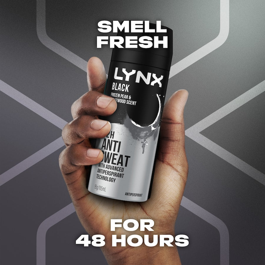 Lynx Black Antiperspirant Deodorant aerosol can, offering 72-hour sweat protection with cedarwood and frozen pear scent.