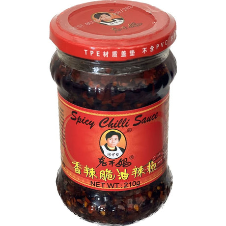 Laoganma Spicy Chilli Sauce bottle showcasing a vibrant blend of flavors and heat, perfect for various culinary uses.