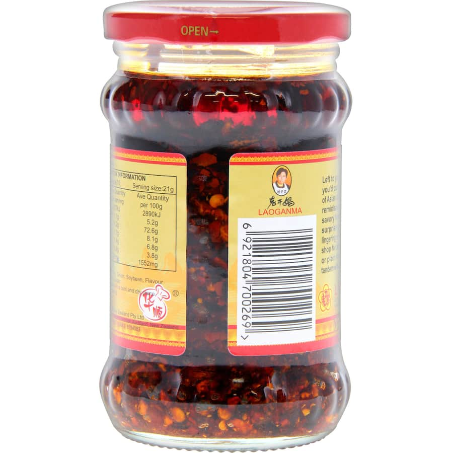 Laoganma Spicy Chilli Sauce bottle, perfect for adding heat and flavor to meals, ideal for marinating and dipping.