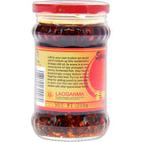 A bottle of Laoganma Spicy Chilli Sauce, featuring bold red color, perfect for enhancing dishes with flavor and heat.