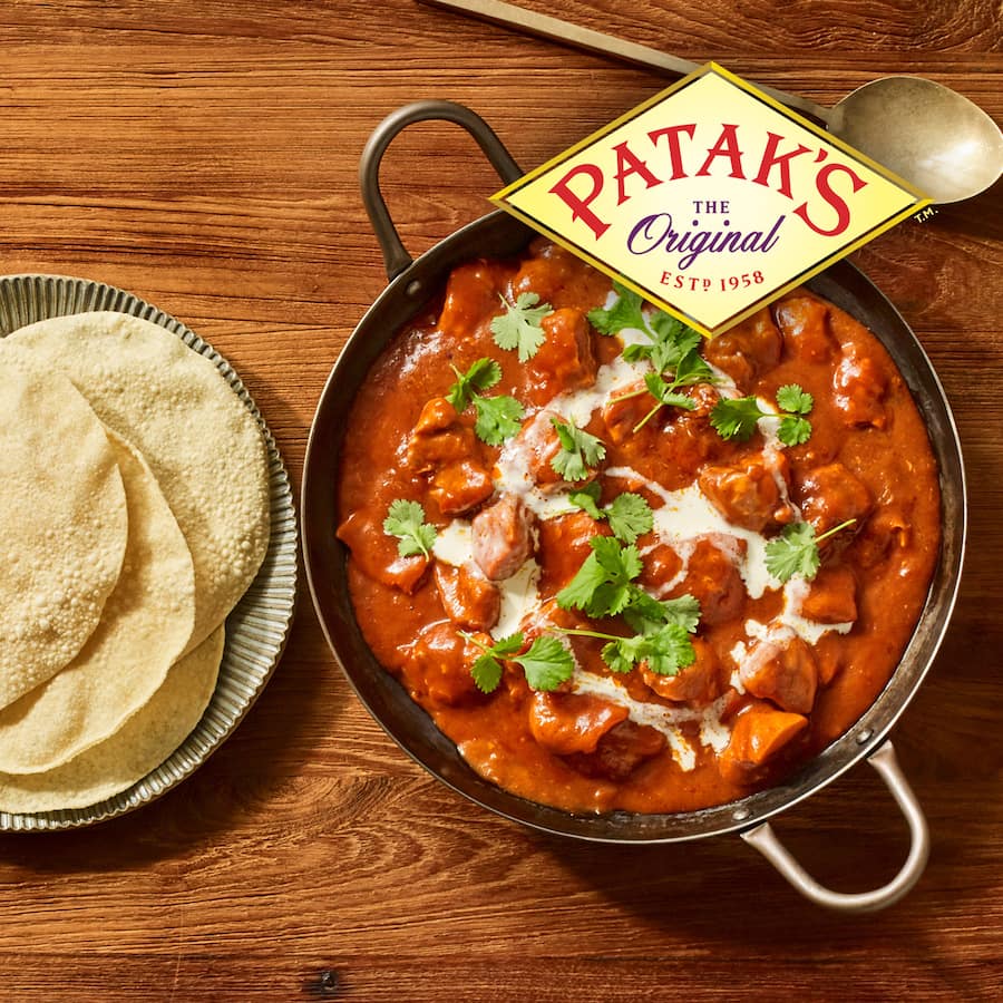 Patak's Tandoori Simmer Sauce bottle showcasing mild, smoky curry for easy, authentic Indian meals in just 20 minutes.