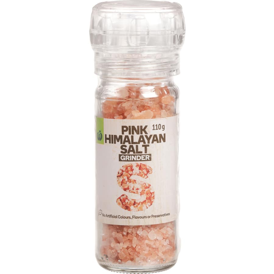 Woolworths Himalayan Pink Salt in a sleek grinder, perfect for seasoning dishes with rich minerals and vibrant hue.