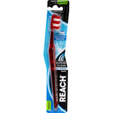 Reach Between Toothbrush Medium with multi-level bristles for deep cleaning and rounded ends to protect gums and enamel.