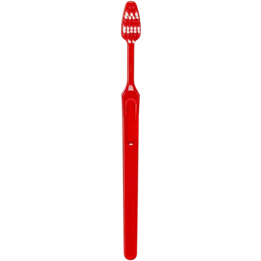 Medium toothbrush with multi-level bristles designed for effective plaque removal and gentle gum care.
