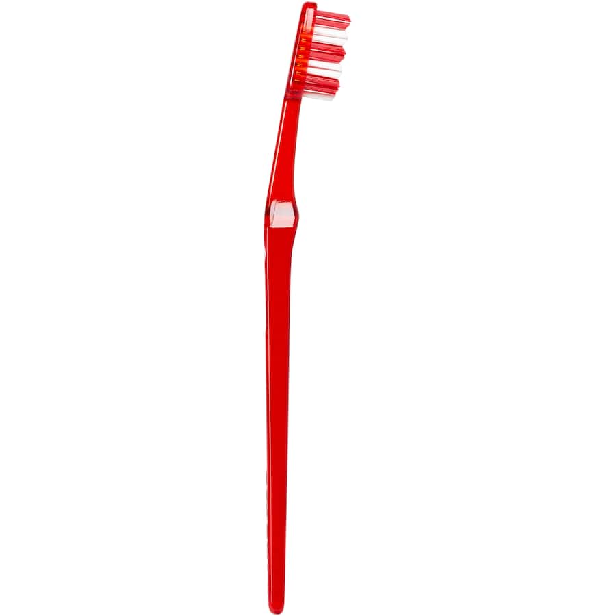 Medium toothbrush with multi-level bristles for deep cleaning between teeth, minimizing gum irritation and enhancing oral hygiene.