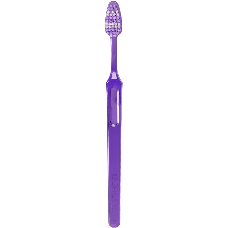 Firm-bristled toothbrush with multi-level design for deep cleaning between teeth, promoting optimal dental hygiene.