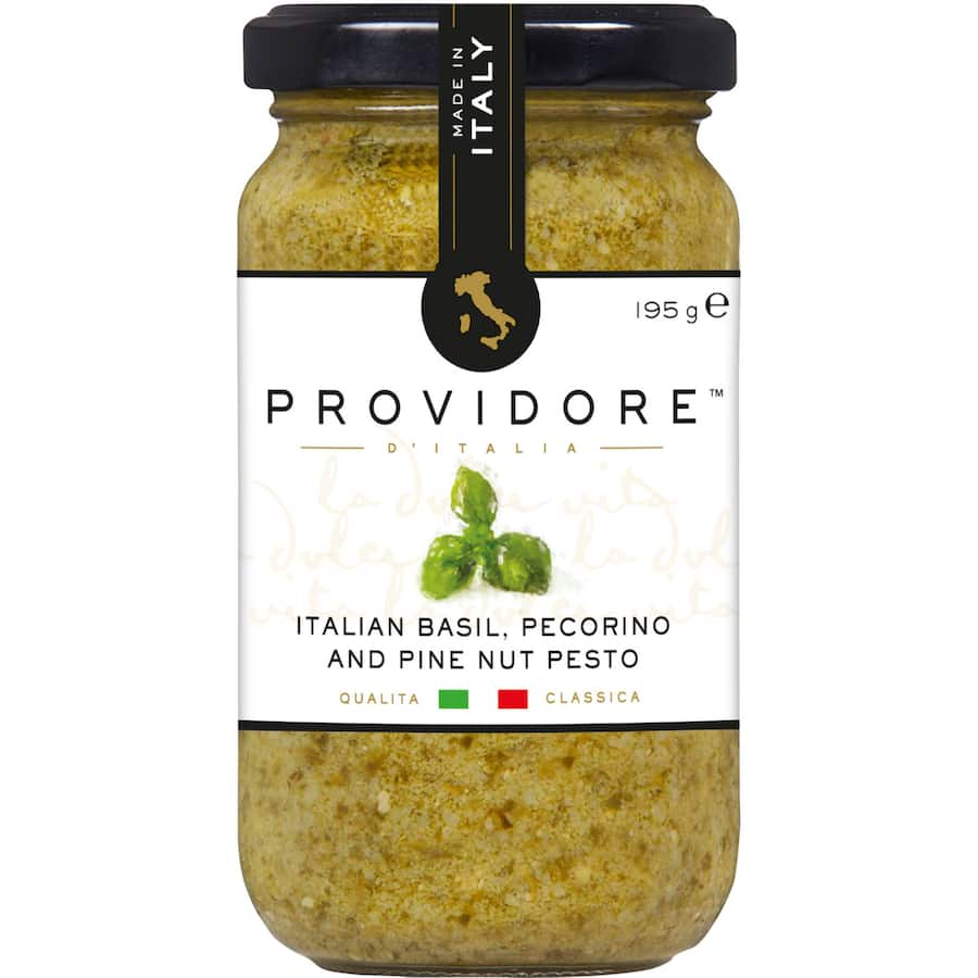 Basil pesto with pecorino and pine nuts, ideal for pasta, dips, and marinades, showcasing authentic Italian flavors.