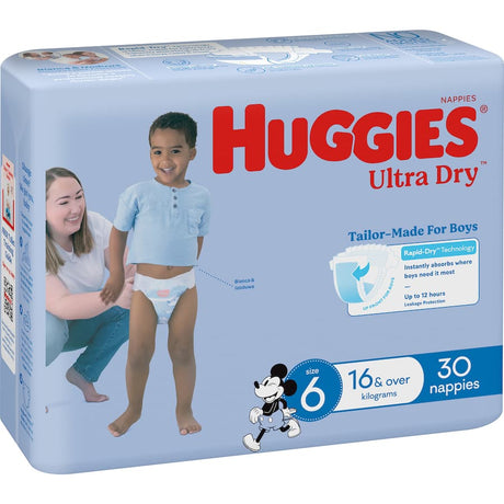 Huggies Ultra Dry Nappies for boys size 6 with targeted absorbency, wetness indicator, and fun Mickey Mouse designs.