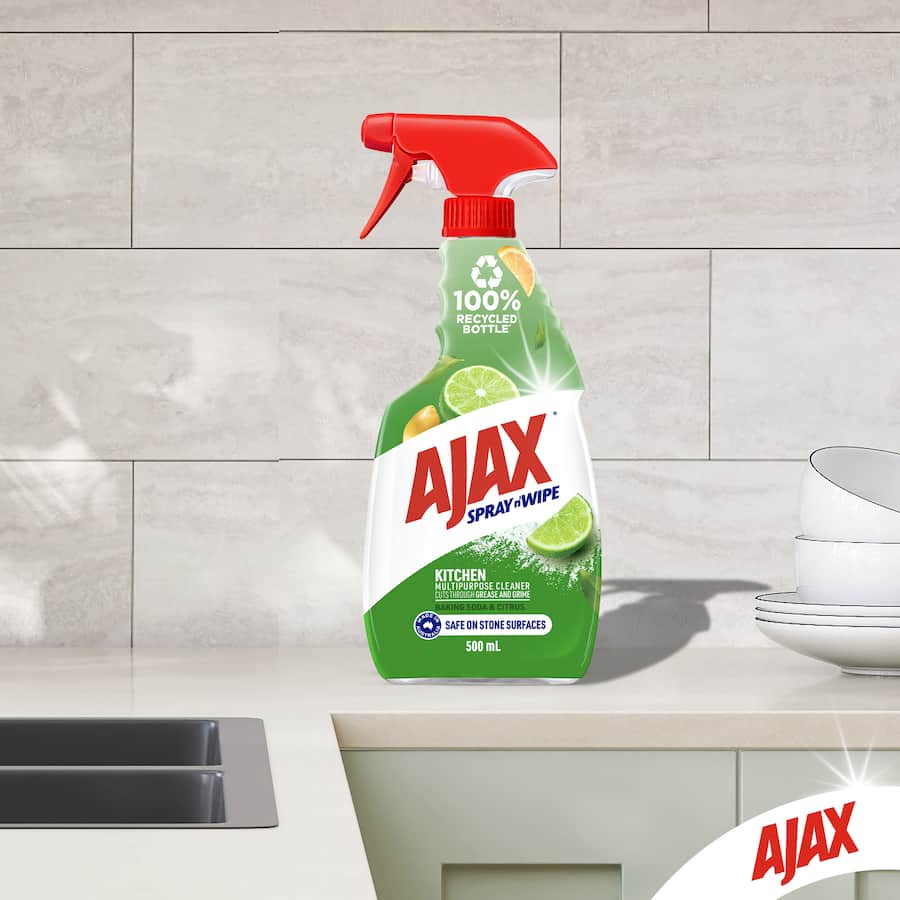 Ajax Spray N Wipe Kitchen Cleaner with Baking Soda, ideal for stone surfaces, effectively tackles grease with a fresh citrus scent.