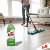 Ajax Floor Cleaner in a 100% recycled bottle, featuring baking soda for powerful, eco-friendly cleaning of stone surfaces.