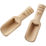 Small, eco-friendly wooden spice scoops for precise measuring and effortless spice addition in cooking.